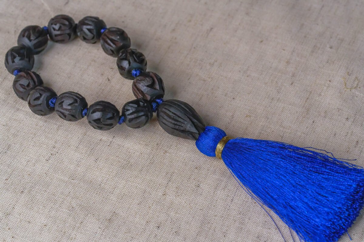 Pure Tulasi Japa mala with Sri Radhe carving name . best Quality.