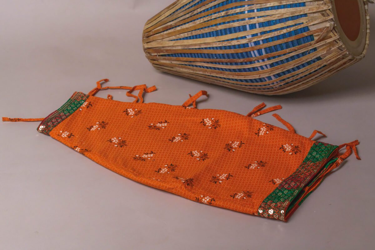 Orange Mridanga cover accessory for protecting your drum.