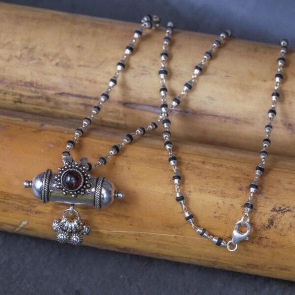 Silver kavacha with Tulasi mala  beads.