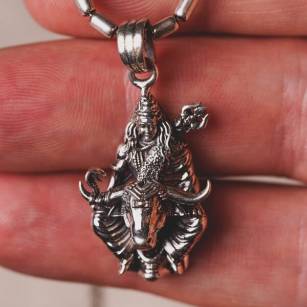 This elegant Lord Shiva silver pendant, paired with a classic 20-inch silver chain, is a profound statement of faith and a beautiful adornment for any devotee