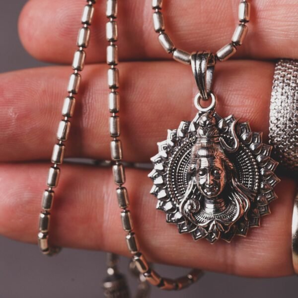 This elegant Lord Shiva silver pendant, paired with a classic 20-inch silver chain, is a profound statement of faith and a beautiful adornment for any devotee