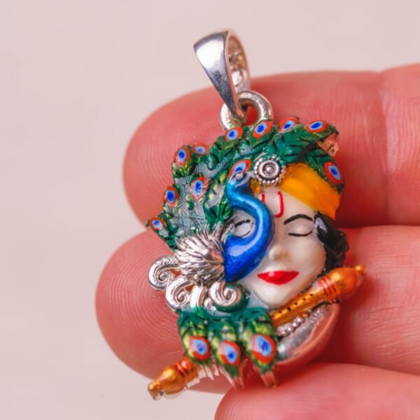 This stunning Sri Krishna silver pendant  is a unique and captivating piece of devotional jewelry, blending traditional reverence with a sophisticated, contemporary aesthetic.