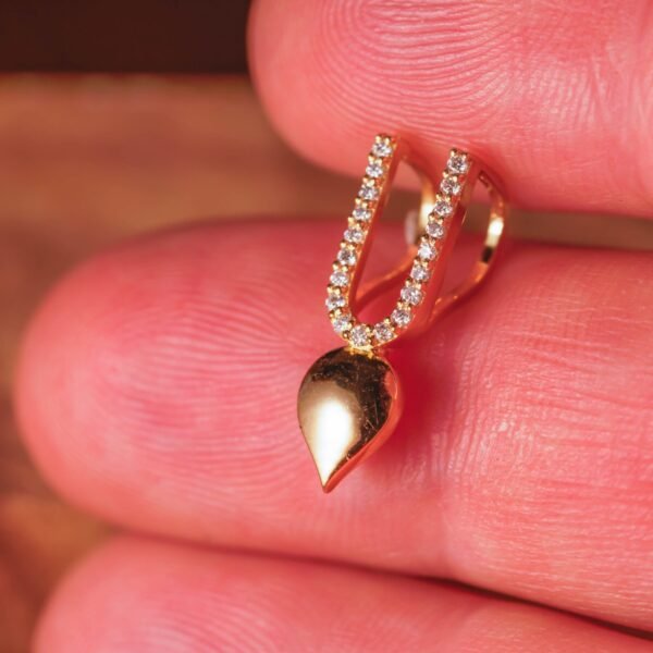 This exquisite Tilak pendant, combining the purity of silver with the richness of gold plating, is a profound and elegant symbol of devotion specifically designed for Vaishnavas.