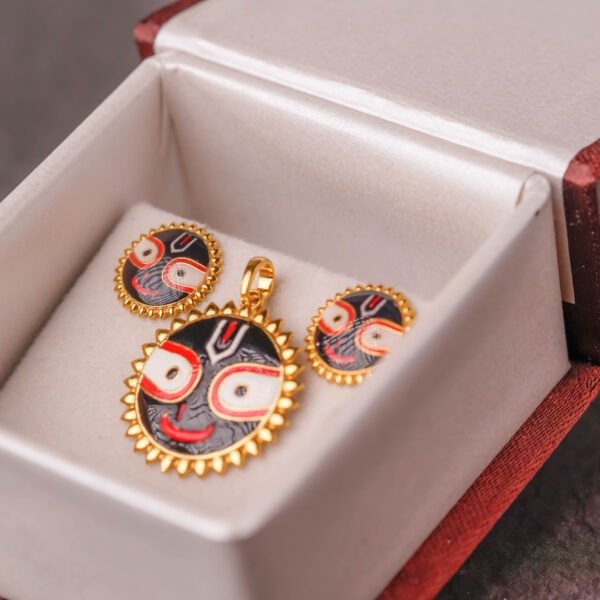 Lord Jagannath with this breathtakingly beautiful 18K Gold Pendant and matching Earrings set. This set is a perfect timeless devotion