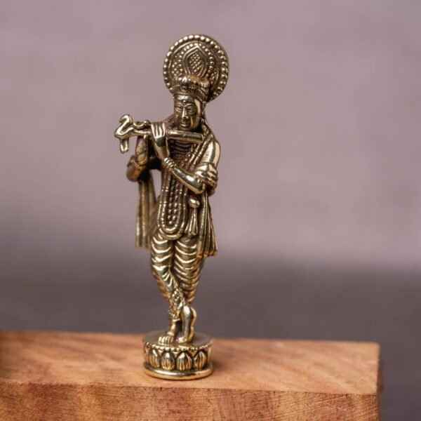 A Brass Murti of Lord Krishna, 2.52 inches in height, is a popular and endearing choice for devotees.
