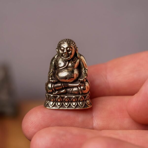 A Brass Murti of Lord Buddha, 1 inch in height, is a popular and universally appealing item