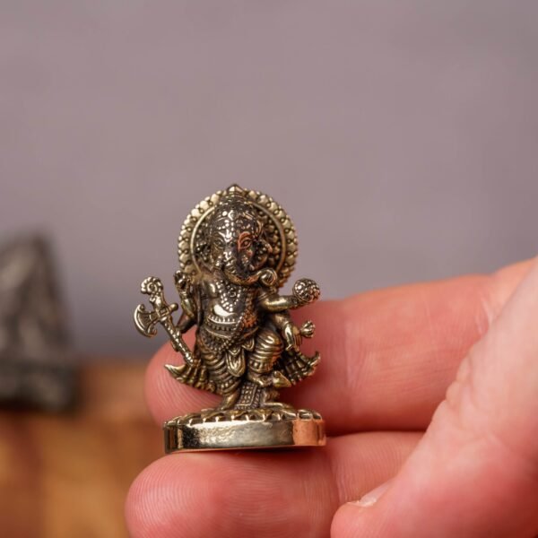 A Brass Murti of Lord Ganesha, 1.31 inches, is a truly miniature and highly versatile idol, perfect for devotional and decorative purposes.