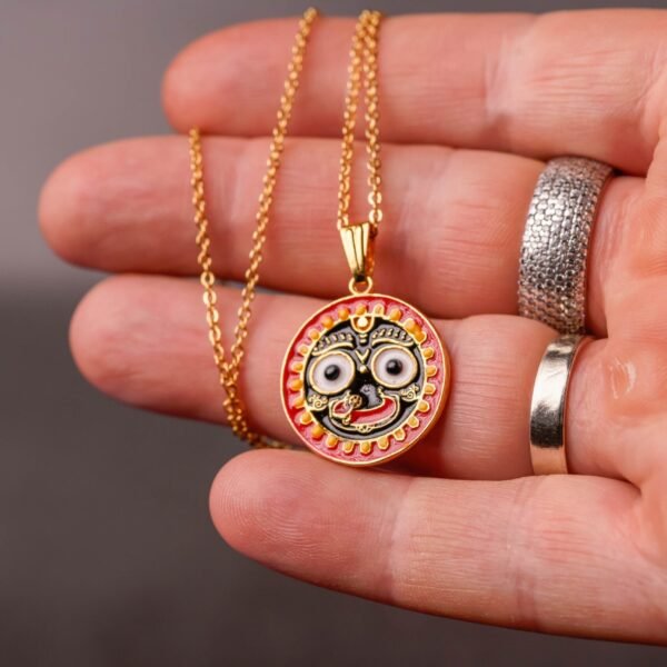 A Metal Jagannath Pendant with a Metal Chain is a beautiful and spiritually significant piece of devotional jewelry
