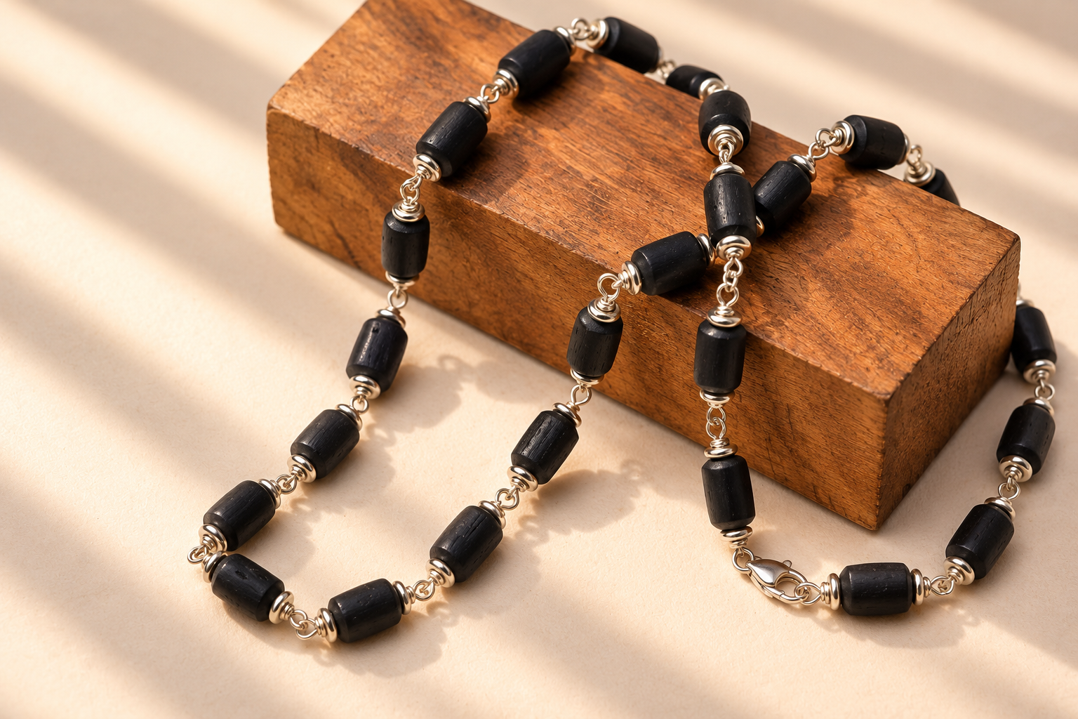 Handcrafted Black Bead Necklace on Wood